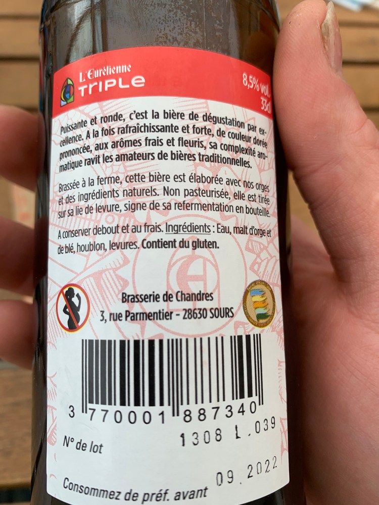 Contre-étiquette de la bière triple de L'Eurélienne. Les promesses sont tenues.